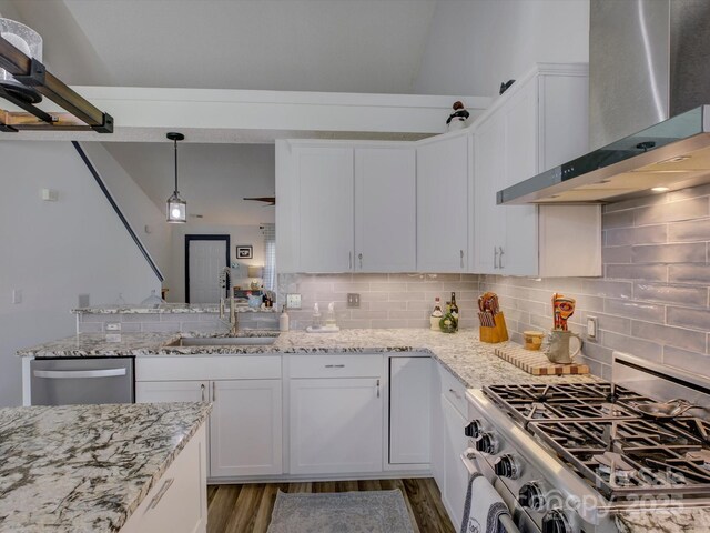 1488 Meadow Glen Ln, Rock Hill, SC 29730 - kitchen featuring stainless steel appliances, wall chimney exhaust hood, a sink, tasteful backsplash, and white cabinetry