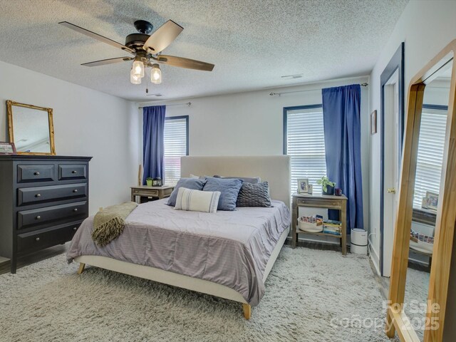 1488 Meadow Glen Ln, Rock Hill, SC 29730 - bedroom with a textured ceiling, light colored carpet, and a ceiling fan