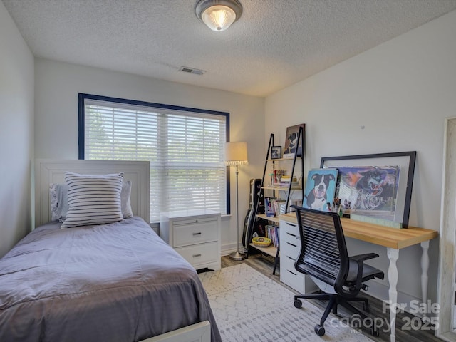 1488 Meadow Glen Ln, Rock Hill, SC 29730 - bedroom with a textured ceiling, wood finished floors, and a desk