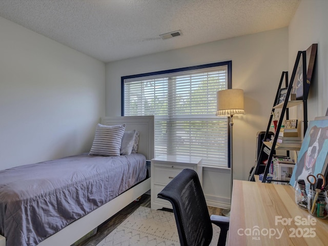 1488 Meadow Glen Ln, Rock Hill, SC 29730 - bedroom featuring wood finished floors and a textured ceiling