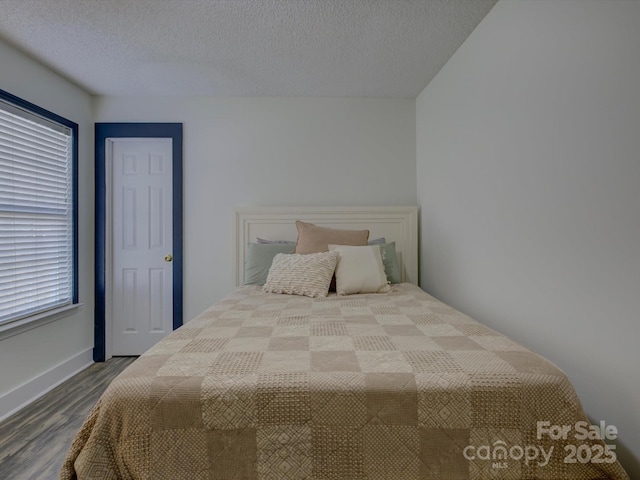 1488 Meadow Glen Ln, Rock Hill, SC 29730 - bedroom featuring dark wood-style floors and a textured ceiling