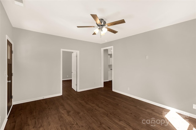 119 Washington St, York, SC 29745 - empty room featuring baseboards, a ceiling fan, and dark wood-type flooring