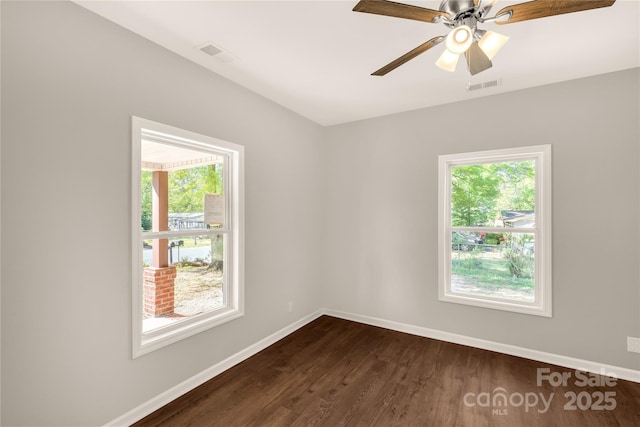 119 Washington St, York, SC 29745 - empty room with healthy amount of natural light, baseboards, dark wood-type flooring, and ceiling fan
