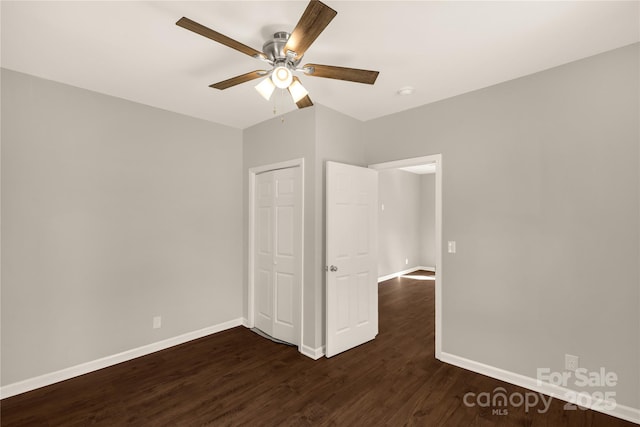 119 Washington St, York, SC 29745 - empty room featuring a ceiling fan, dark wood-type flooring, and baseboards