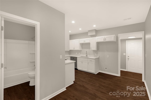 119 Washington St, York, SC 29745 - kitchen featuring a sink, white cabinets, dark wood-style floors, baseboards, and recessed lighting
