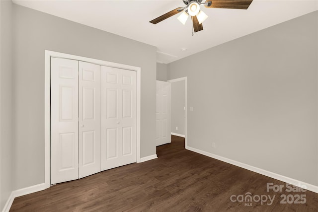 119 Washington St, York, SC 29745 - unfurnished bedroom with dark wood finished floors, a closet, baseboards, and ceiling fan