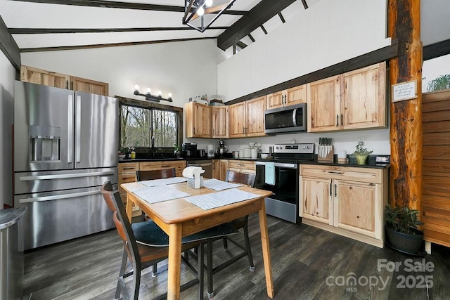 kitchen with beam ceiling, dark countertops, high vaulted ceiling, dark wood-type flooring, and appliances with stainless steel finishes