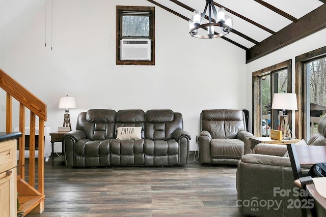 living area with high vaulted ceiling, wood finished floors, a chandelier, and beamed ceiling