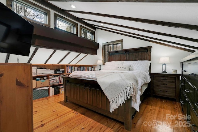 bedroom featuring recessed lighting, hardwood / wood-style floors, and vaulted ceiling with beams