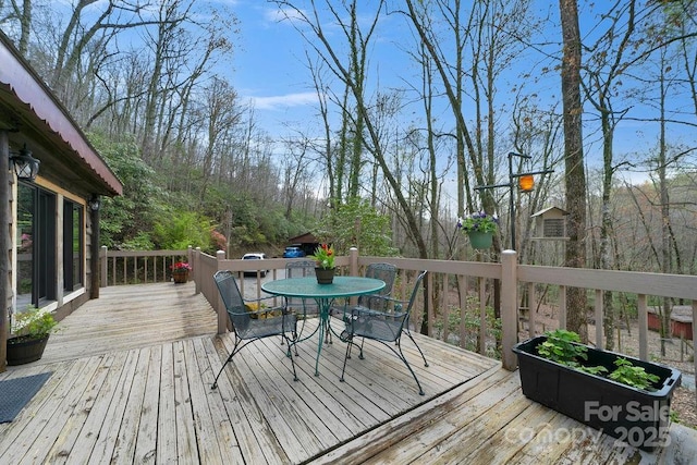 deck featuring outdoor dining area