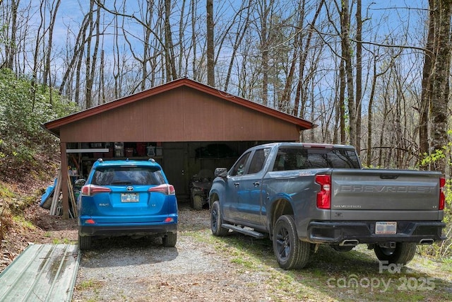 garage featuring a detached carport