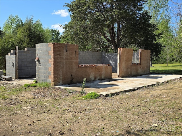 view of gate featuring fence