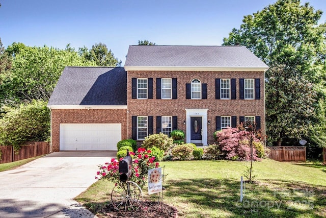145 Meadow Pond Ln, Mooresville, NC 28117 - view of front of property featuring an attached garage, concrete driveway, brick siding, and roof with shingles