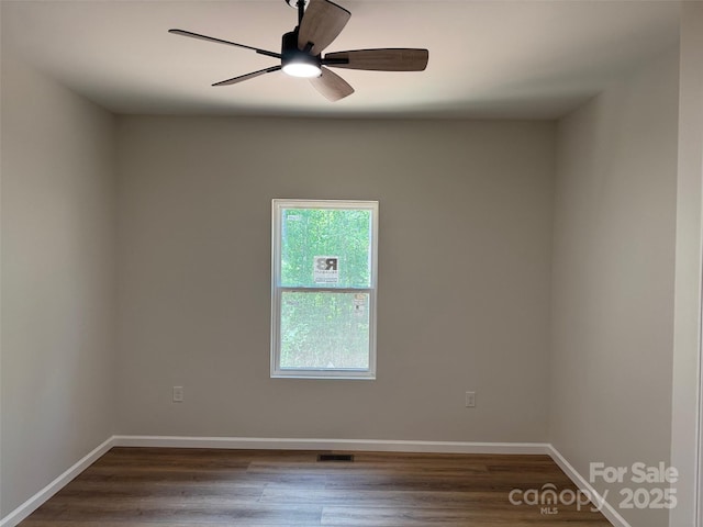 122 39th Avenue Ct NW, Hickory, NC 28601 - empty room with dark wood-type flooring and baseboards