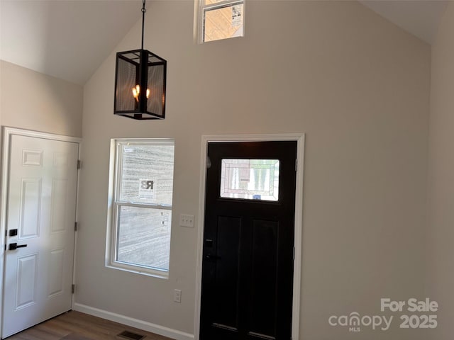 122 39th Avenue Ct NW, Hickory, NC 28601 - entrance foyer with healthy amount of natural light, wood finished floors, high vaulted ceiling, and baseboards