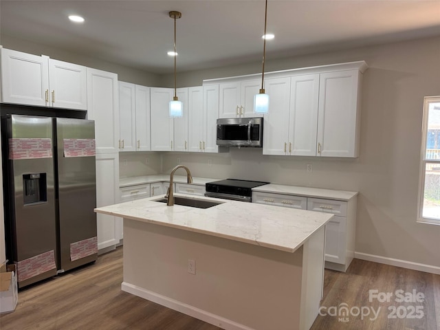 122 39th Avenue Ct NW, Hickory, NC 28601 - kitchen with stainless steel appliances, a sink, wood finished floors, white cabinetry, and recessed lighting