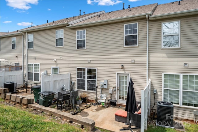 back of house with a patio, fence, and cooling unit