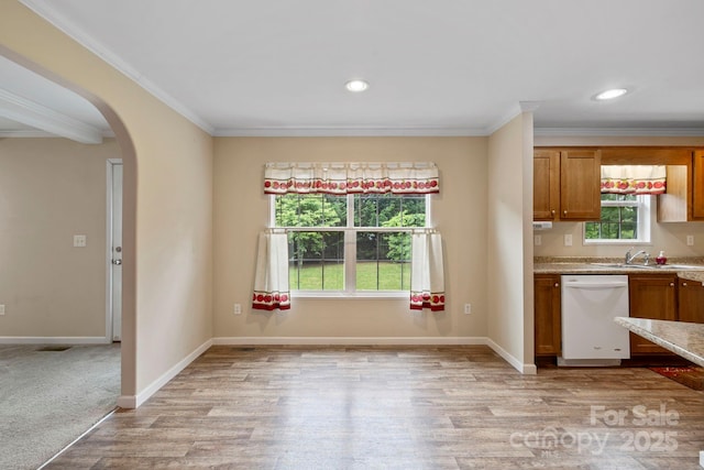 255 Jackson Loop Rd, Flat Rock, NC 28731 - kitchen with white dishwasher, ornamental molding, arched walkways, a sink, and brown cabinetry