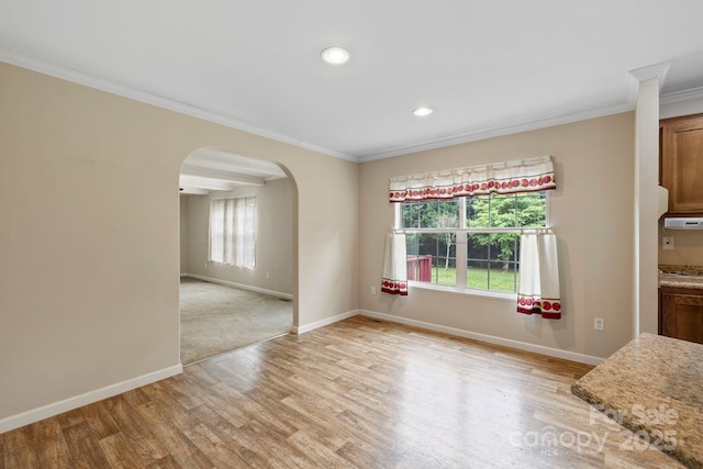 255 Jackson Loop Rd, Flat Rock, NC 28731 - unfurnished dining area with arched walkways, ornamental molding, baseboards, light wood finished floors, and recessed lighting
