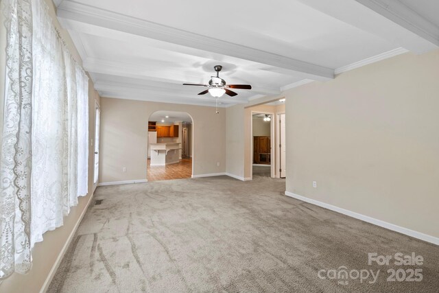 255 Jackson Loop Rd, Flat Rock, NC 28731 - unfurnished living room featuring arched walkways, carpet, a ceiling fan, crown molding, and beamed ceiling