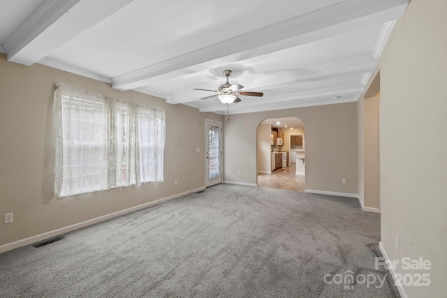 255 Jackson Loop Rd, Flat Rock, NC 28731 - empty room with arched walkways, beam ceiling, carpet, ceiling fan, and baseboards
