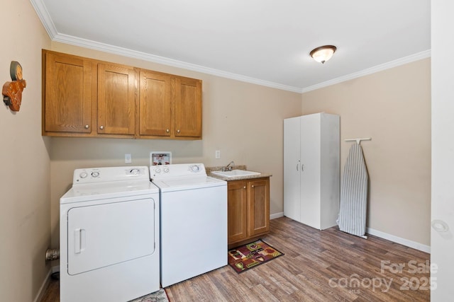 255 Jackson Loop Rd, Flat Rock, NC 28731 - washroom with cabinet space, separate washer and dryer, light wood-type flooring, ornamental molding, and baseboards