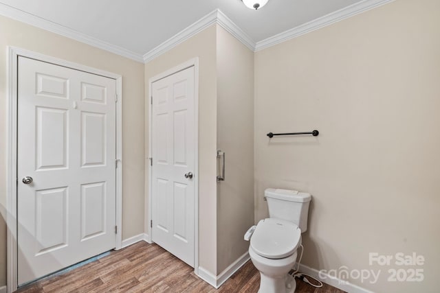 255 Jackson Loop Rd, Flat Rock, NC 28731 - bathroom featuring wood finished floors, toilet, ornamental molding, and baseboards