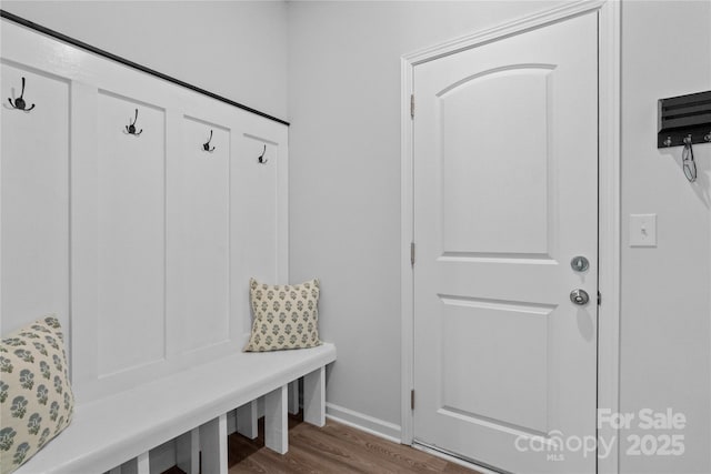 mudroom with wood finished floors and baseboards