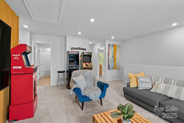 carpeted living room with attic access, baseboards, and recessed lighting