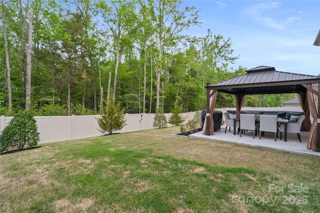 view of yard featuring a gazebo, a fenced backyard, and a patio