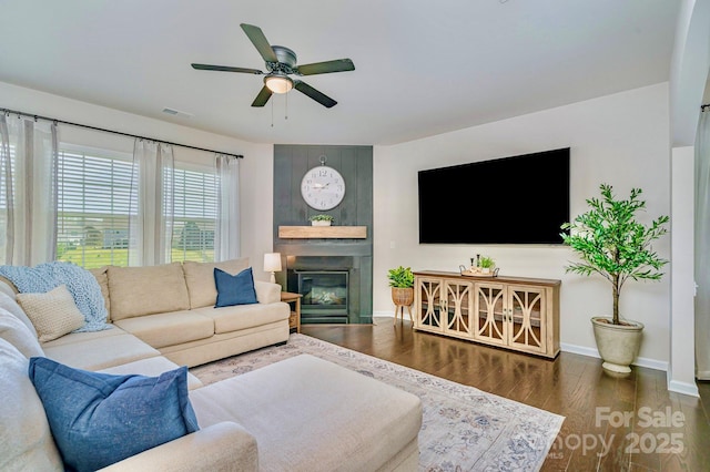 17231 Rider Wood Ln, Charlotte, NC 28278 - living room featuring baseboards, wood finished floors, ceiling fan, and a large fireplace