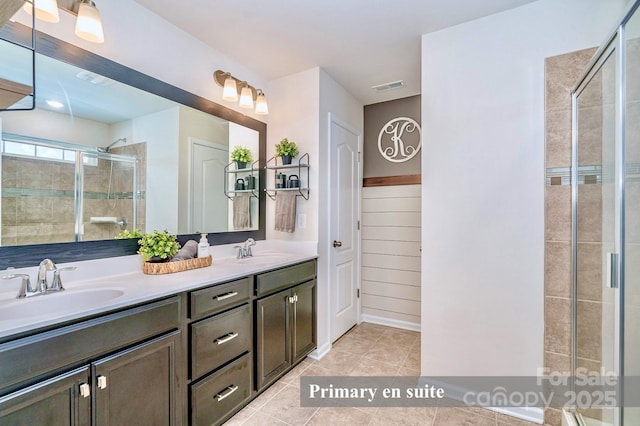 17231 Rider Wood Ln, Charlotte, NC 28278 - bathroom with a stall shower, double vanity, and tile patterned flooring
