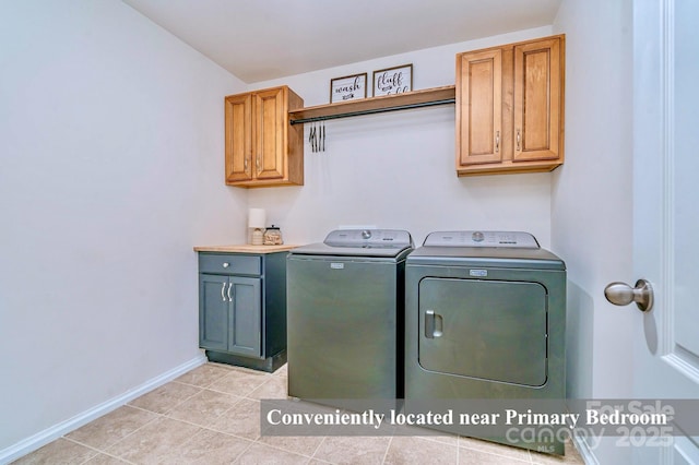 17231 Rider Wood Ln, Charlotte, NC 28278 - washroom featuring cabinet space, washing machine and dryer, baseboards, and light tile patterned flooring