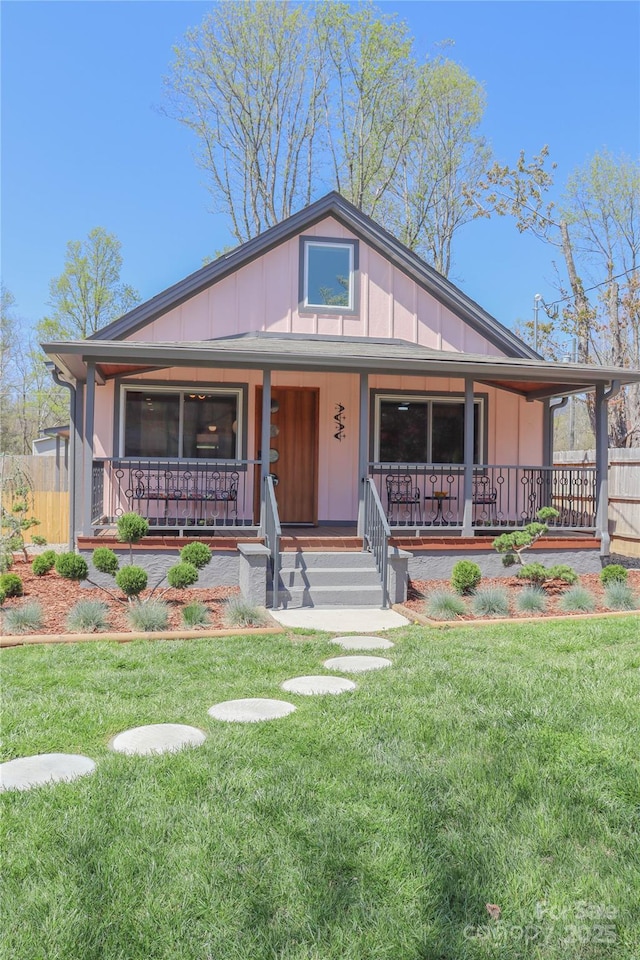 219 Flat Creek Rd, Black Mountain, NC 28711 - view of front of house featuring a front lawn and covered porch