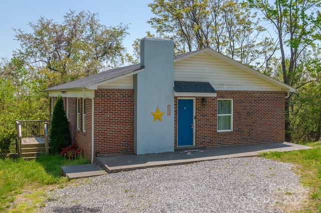 963 Kenham Pl SW, Lenoir, NC 28645 - single story home with brick siding, a shingled roof, and a chimney