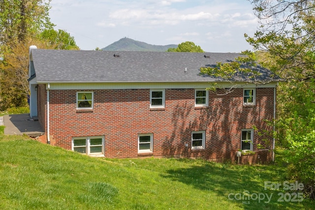 963 Kenham Pl SW, Lenoir, NC 28645 - back of property with roof with shingles, a yard, and brick siding