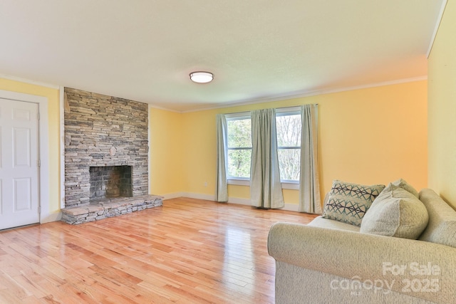 963 Kenham Pl SW, Lenoir, NC 28645 - living area with crown molding, wood finished floors, a fireplace, and baseboards
