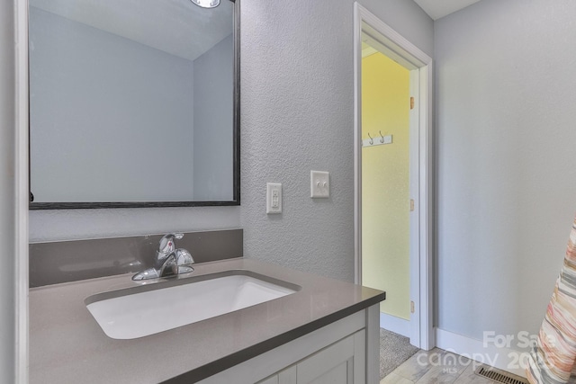 963 Kenham Pl SW, Lenoir, NC 28645 - bathroom with visible vents, vanity, and a textured wall