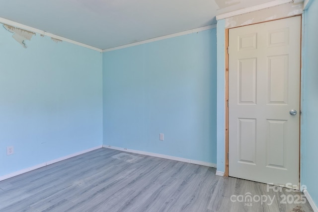 963 Kenham Pl SW, Lenoir, NC 28645 - unfurnished room featuring ornamental molding, baseboards, and wood finished floors