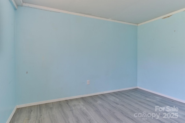 963 Kenham Pl SW, Lenoir, NC 28645 - empty room with crown molding, wood finished floors, and baseboards