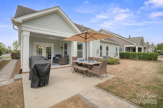 13115 Union Square Dr, Huntersville, NC 28078 - back of house with a yard, outdoor dining area, ceiling fan, central AC, and a patio area