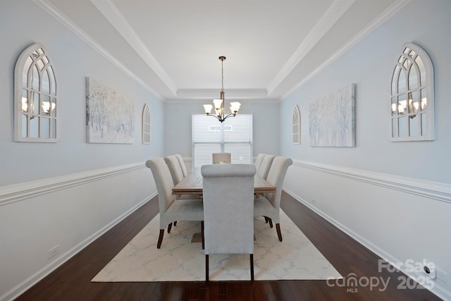 13115 Union Square Dr, Huntersville, NC 28078 - dining area with a tray ceiling, baseboards, ornamental molding, a chandelier, and wood finished floors