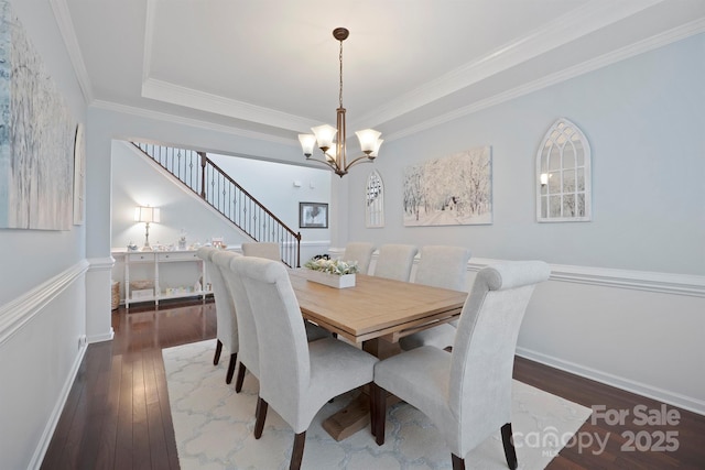 13115 Union Square Dr, Huntersville, NC 28078 - dining space featuring ornamental molding, stairs, a notable chandelier, and hardwood / wood-style floors