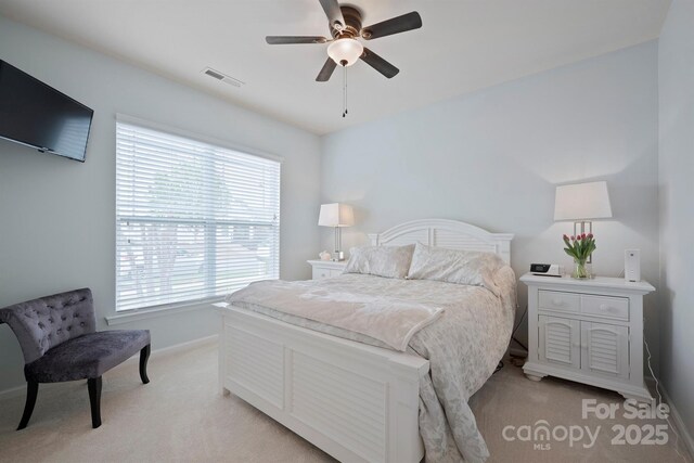 13115 Union Square Dr, Huntersville, NC 28078 - bedroom featuring baseboards, light carpet, visible vents, and a ceiling fan