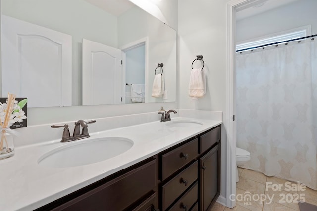 13115 Union Square Dr, Huntersville, NC 28078 - full bath with double vanity, toilet, tile patterned flooring, and a sink