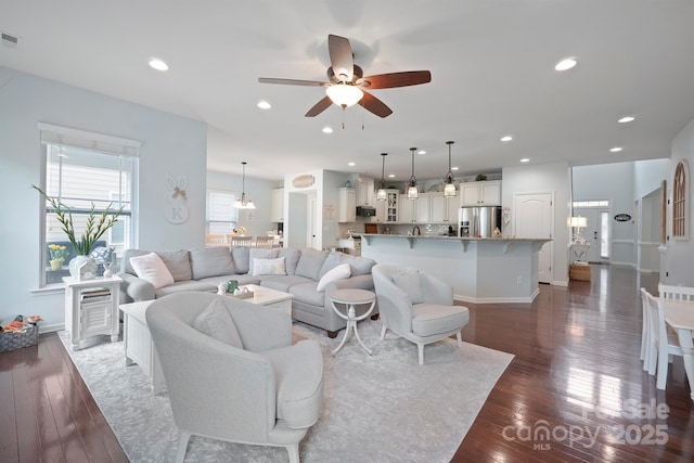 13115 Union Square Dr, Huntersville, NC 28078 - living room featuring dark wood finished floors, baseboards, a ceiling fan, and recessed lighting