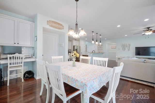 13115 Union Square Dr, Huntersville, NC 28078 - dining space featuring recessed lighting, dark wood-style floors, ceiling fan, and a chandelier