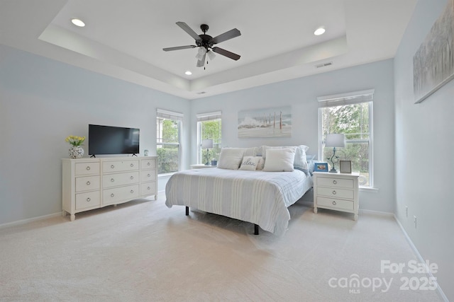 13115 Union Square Dr, Huntersville, NC 28078 - bedroom featuring light carpet, a raised ceiling, recessed lighting, and multiple windows