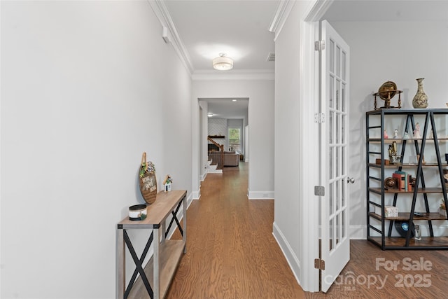 1390 Cedardale Ln, Denver, NC 28037 - hallway featuring wood finished floors, ornamental molding, baseboards, and french doors