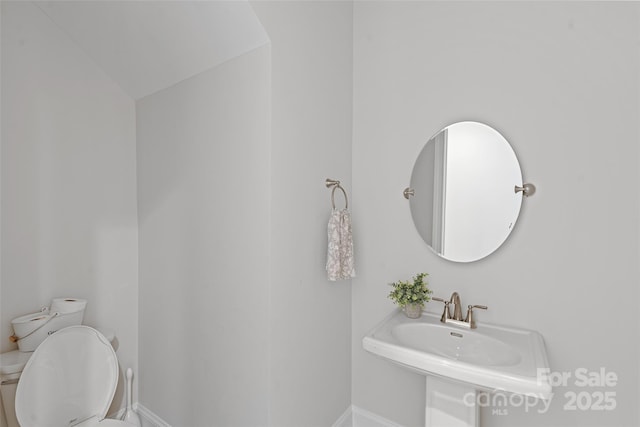 1390 Cedardale Ln, Denver, NC 28037 - bathroom with toilet, baseboards, and a sink
